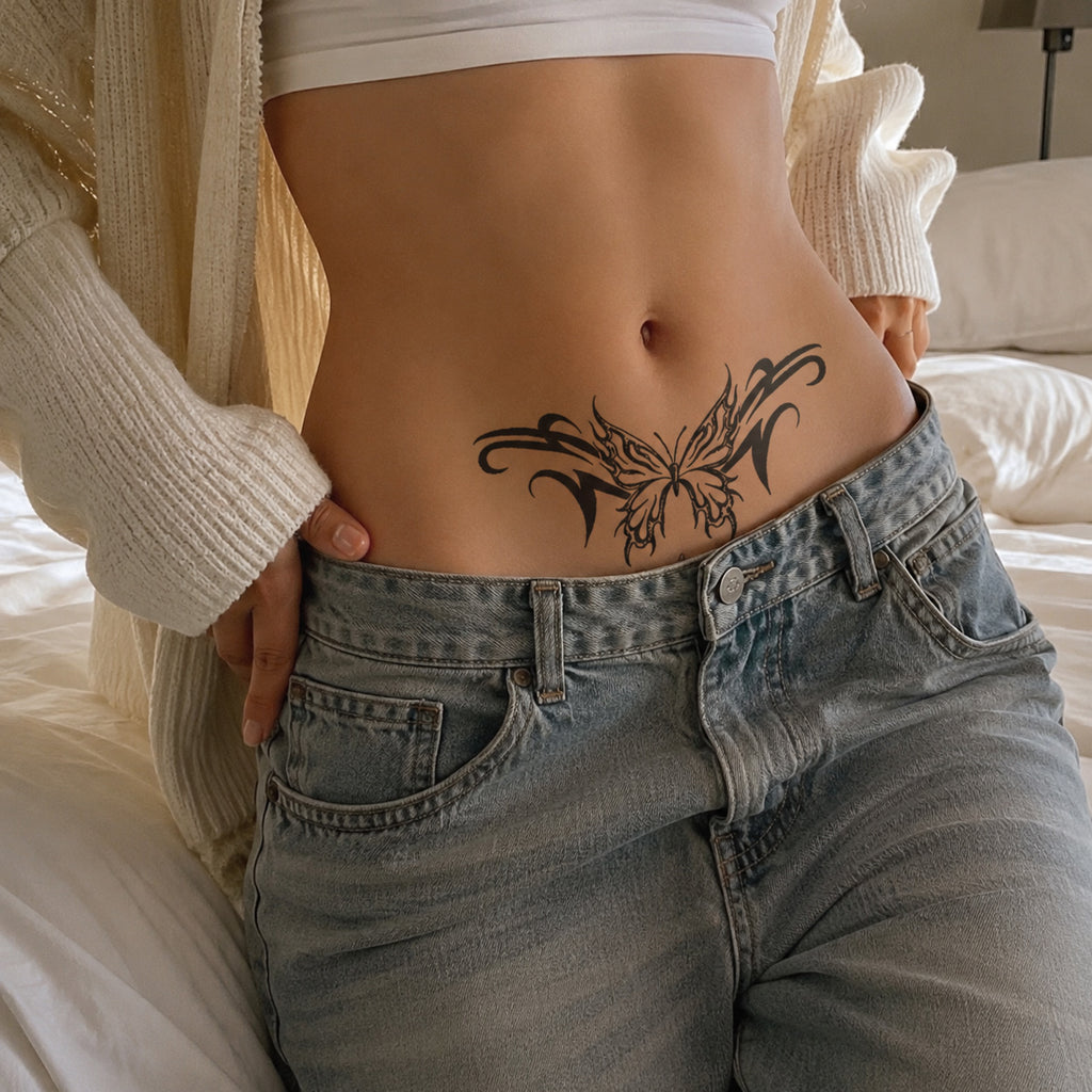 Woman wearing the Midnight Temptation succubus temporary tattoo above low-rise jeans