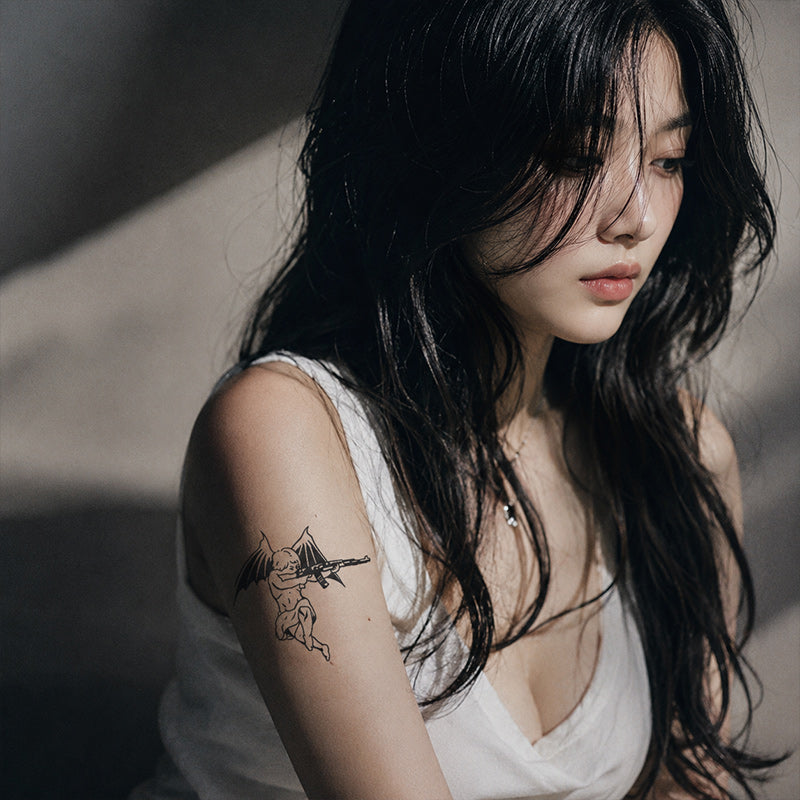 Close-up of Rebel Cupid Gun Temporary Tattoo Stickers