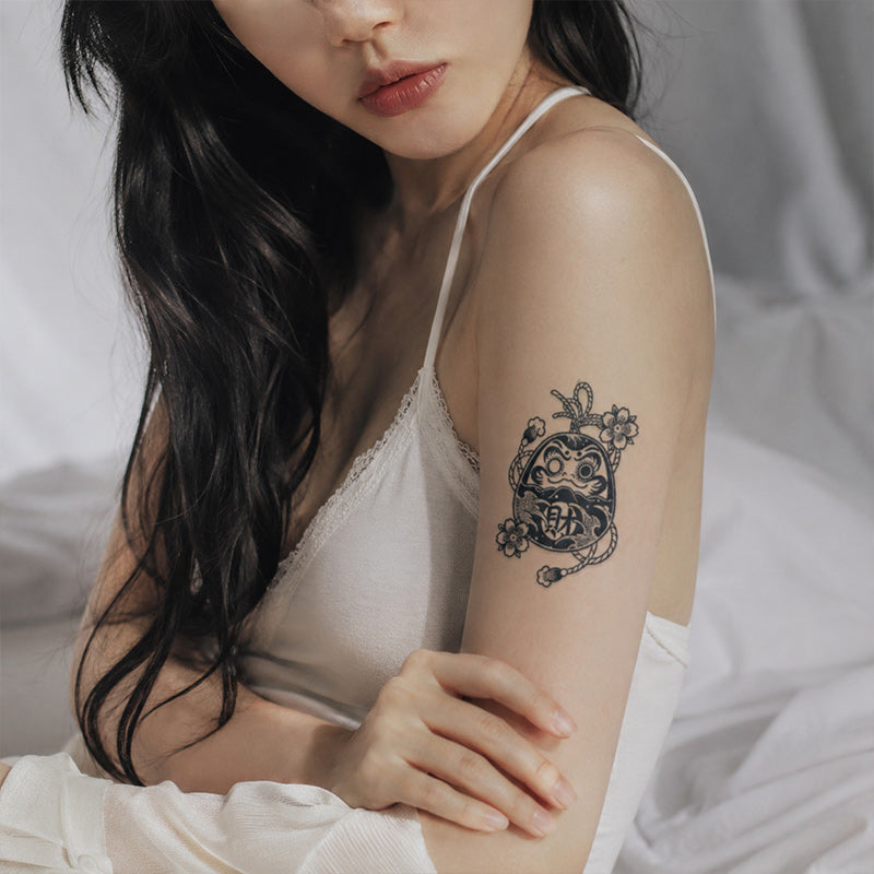 Close-up of Japanese Daruma Temporary Tattoo Stickers