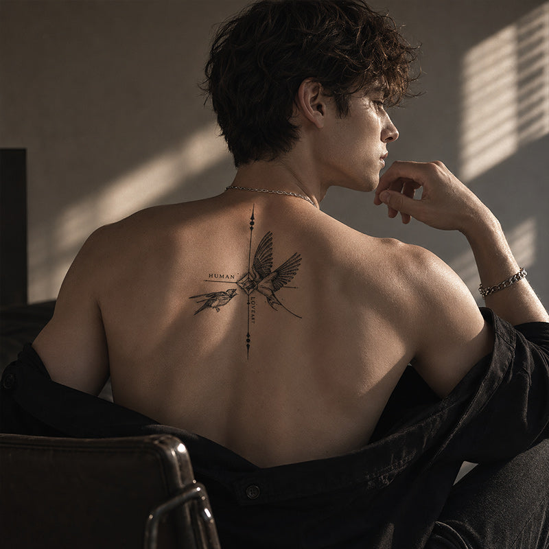 Close-up of Human Love Bird Temporary Tattoo Stickers