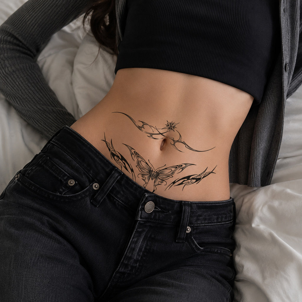 Woman wearing the Starlit Veil succubus temporary tattoo on the lower stomach with black jeans