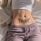 Woman wearing the Infernal Heart succubus temporary tattoo on the lower stomach