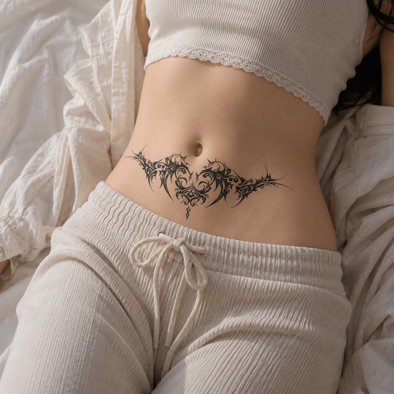 Woman wearing the Thorn Oath succubus temporary tattoo above the waistline