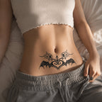close-up of fairy bat wing succubus temporary tattoo on the lower abdomen