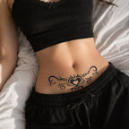 close-up of tribal heart succubus temporary tattoo on the lower abdomen