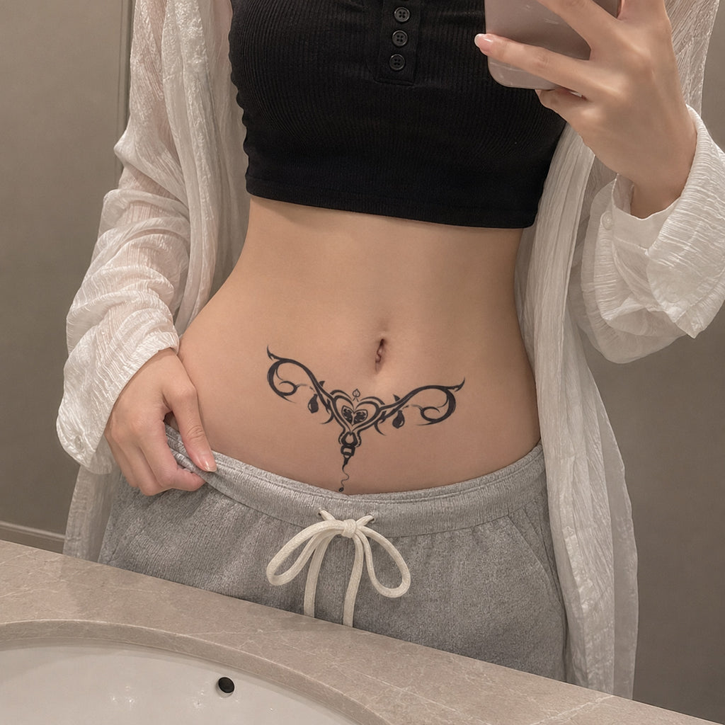 dark siren succubus temporary tattoo placed on the lower stomach above the waistline